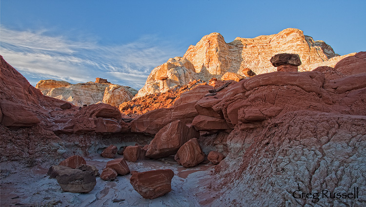 Colorful sunset light illuminates a set of hoodoos in the badlands of the southern part of the Grand Staircase-Escalante National Monument, Utah