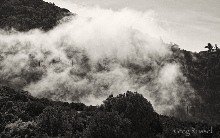 Fog drifts in the valleys of the San Bernardino Mountains above Redlands