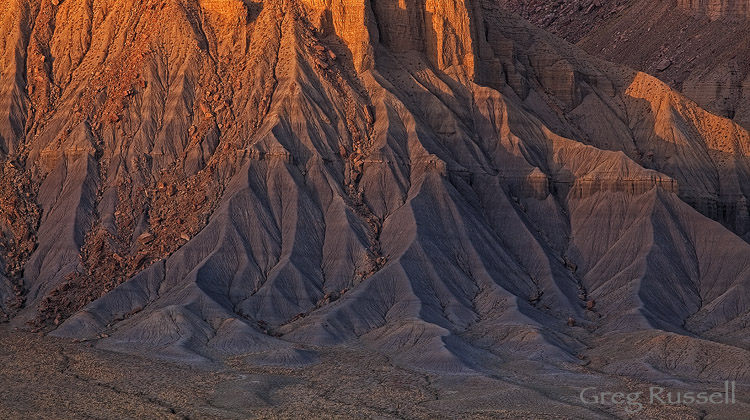 badlands at sunset in the strike valley, capitol reef national park, utah