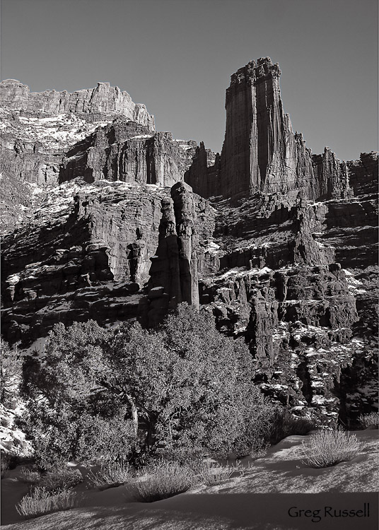 black and white photo of the fisher towers, located near moab, utah