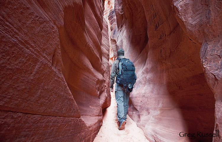a hiker in Wire Pass, southern Utah