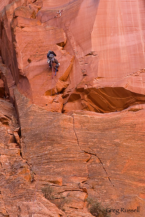 A rock climber ascends the route Moonlight Buttress, Zion National Park, Utah