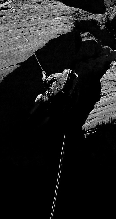 A canyoneer rappels in Zion National Park, Utah
