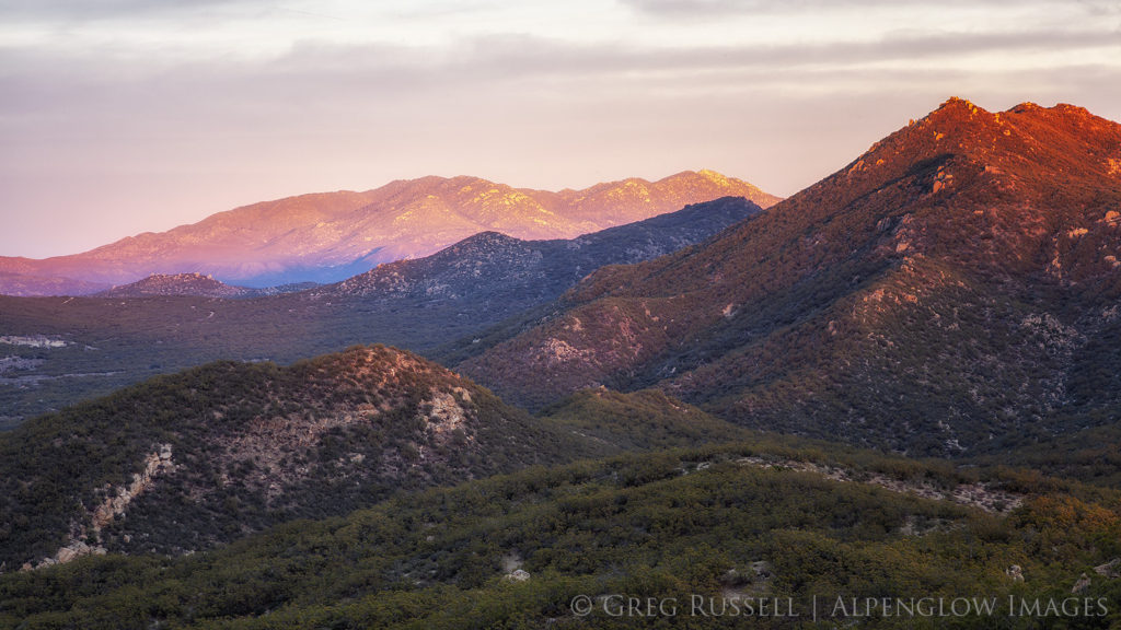 Photograph of the Santa Rosa Mountains illuminated by dramatic sunset colors.