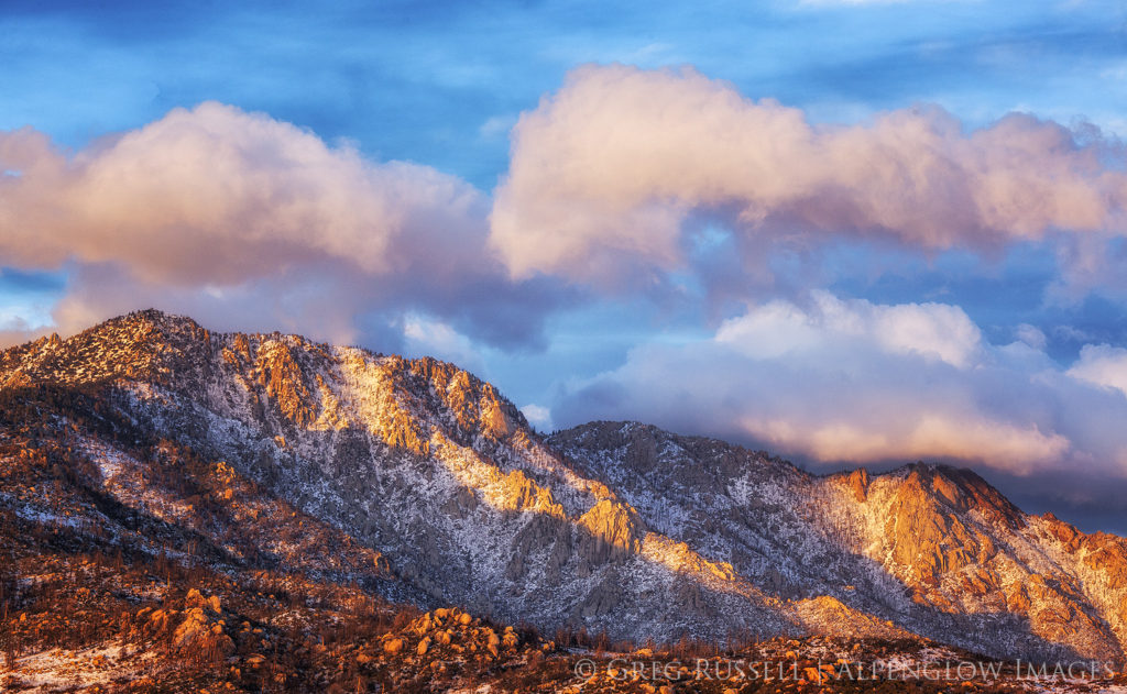 The San Jacinto mountains, covered in fresh snow, at sunset.