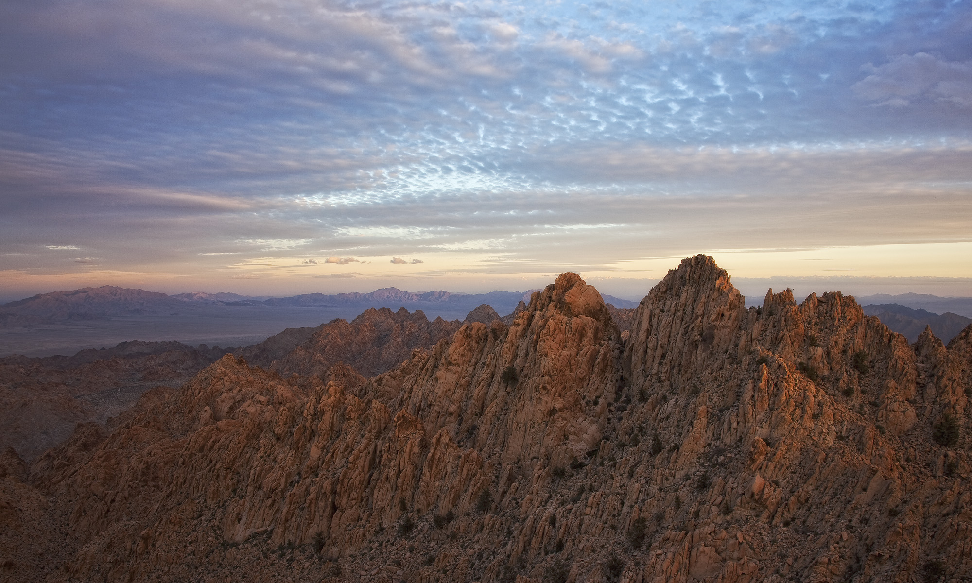 photo of sunset over the coxcomb mountains in eastern joshua tree national park california