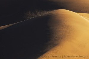 blowing sand on sand dune