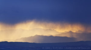 photo of rain storm (virga) and hill layers at sunset in Gold Butte National Monument, Nevada
