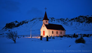 photo of a small white Lutheran church near the small fishing village of Vik Iceland.