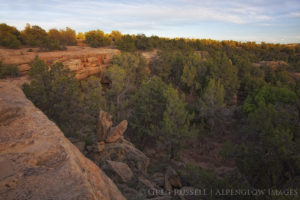 the sun sets over a sandstone cliff in the largo canyon complex of northwestern New Mexico