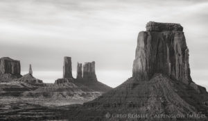 Sandstone towers stand as sunset approaches in Monument Valley Tribal Park, Arizona